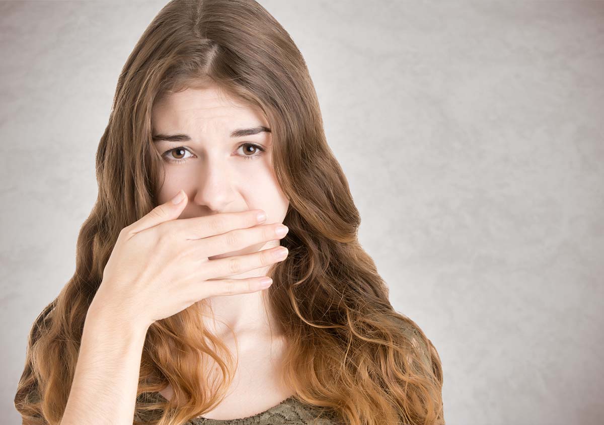Woman hating bad breath